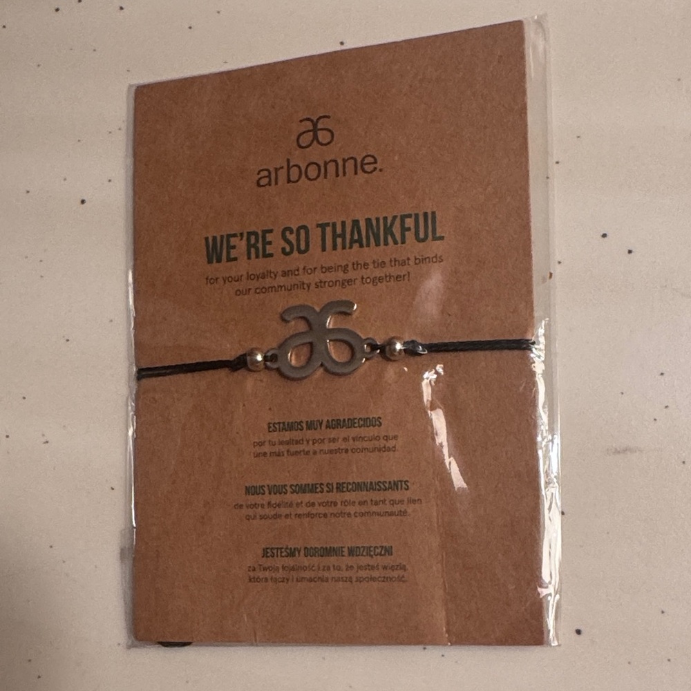 Arbonne Black Cord Bracelet with Silver Logo